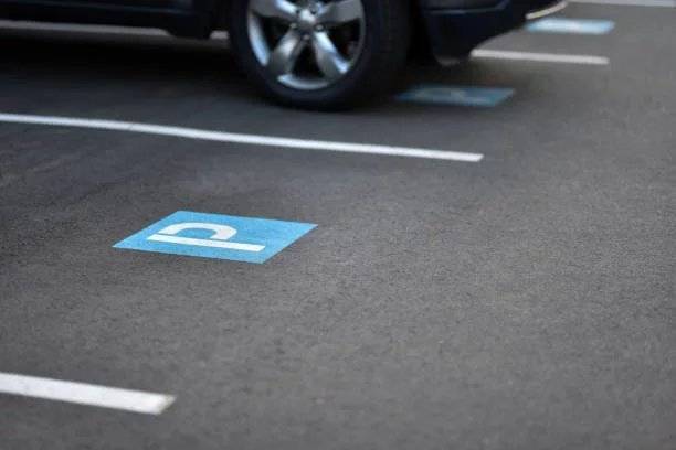 painted parking sign on the asphalt